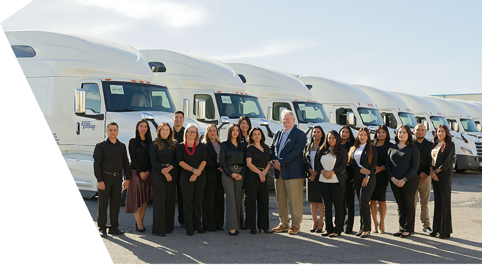 el paso transportation team photo next to truck fleet